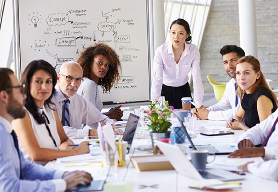 A leader facilitating a strategy session with her team